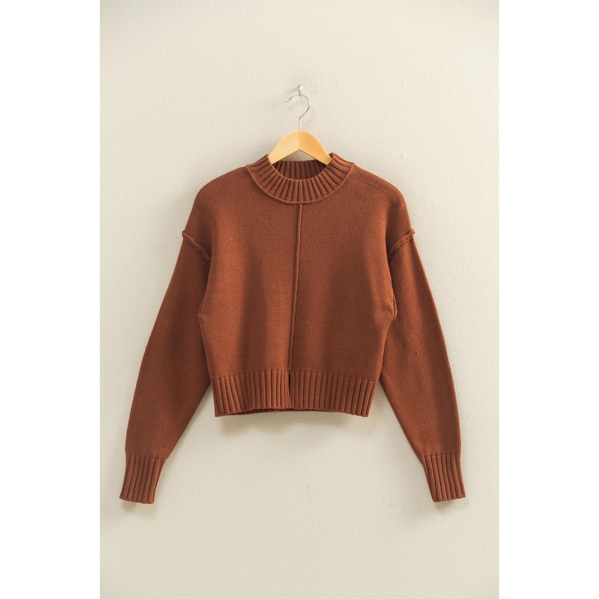 Chestnut colored sweater with a slight mock neck and front seam.
