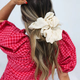 woman wearing kaxi jumbo scrunchie in ivory
