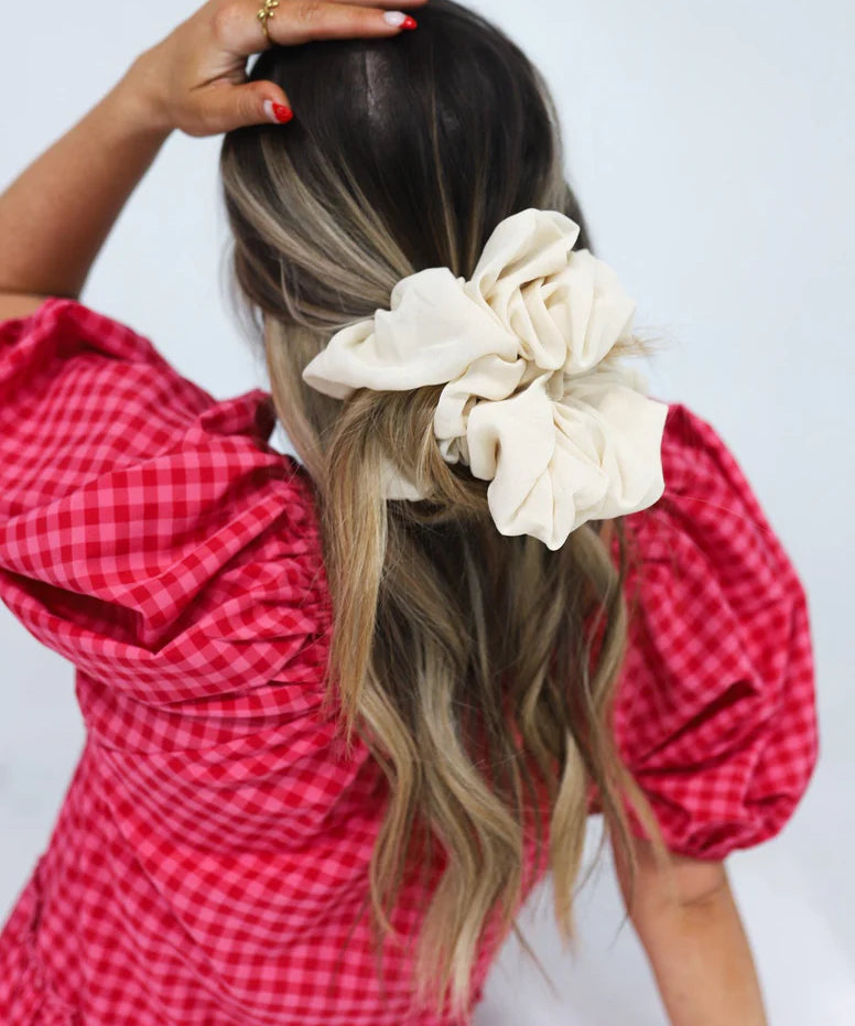 woman wearing kaxi jumbo scrunchie in ivory