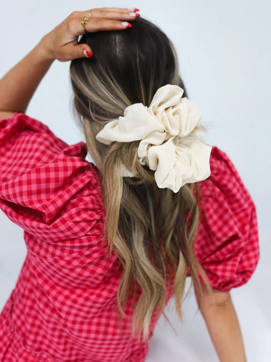 woman wearing kaxi jumbo scrunchie in ivory