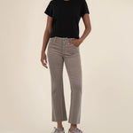 Woman wearing ankle length flare corduroy pants from the brand KUT in the color rosemary.